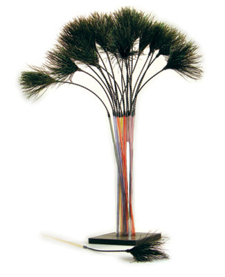 A bundle of long, thin rods with black bristles at the ends, arranged in a glass vase like a bouquet, resembles Vee Enterprises The PURRfect Wispy Bouncer – Irresistible Fun for Your Cat by Vee Enterprises. One rod lies in front.