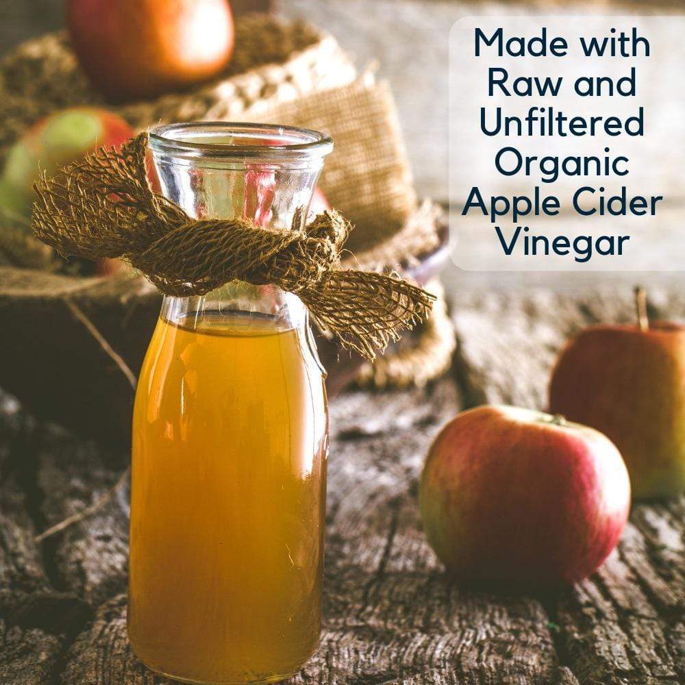 4-Legger Organic Apple Cider Vinegar Dog Rinse in a glass jar with fresh apples, promoting healthy fur