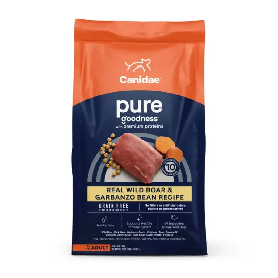 CANIDAE PURE Grain-Free Real Wild Boar & Garbanzo Bean Recipe Top Dry Dog Food, in orange and blue packaging, features a limited ingredient formula with chickpeas and sweet potato—ideal for adult dogs with sensitivities.