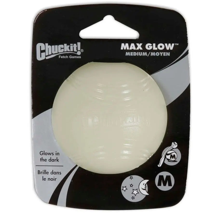A Chuckit!® Max Glow Ball Dog Toy in glow white, by Chuckit!®, is a durable rubber ball for dogs that glows in the dark and comes in medium size black and gray packaging.