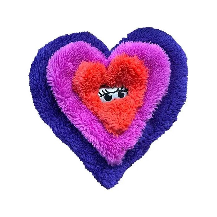 The Cycle Dog Duraplush Eco-Friendly Tough Dog Toy features three plush, textured hearts in purple, pink, and red stacked together; the smallest red heart has cartoon eyes and long lashes. Made by Cycle Dog from recycled materials.