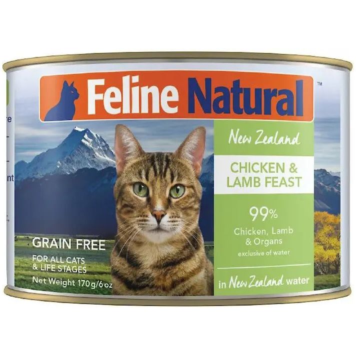 A can of Feline Natural Chicken & Lamb Feast Grain-Free Canned Cat Food by Feline Natural, featuring a tabby cat, mountains, and grassland on the label. Made with cage-free chicken and grass-fed lamb in a 99% meat and organs recipe.