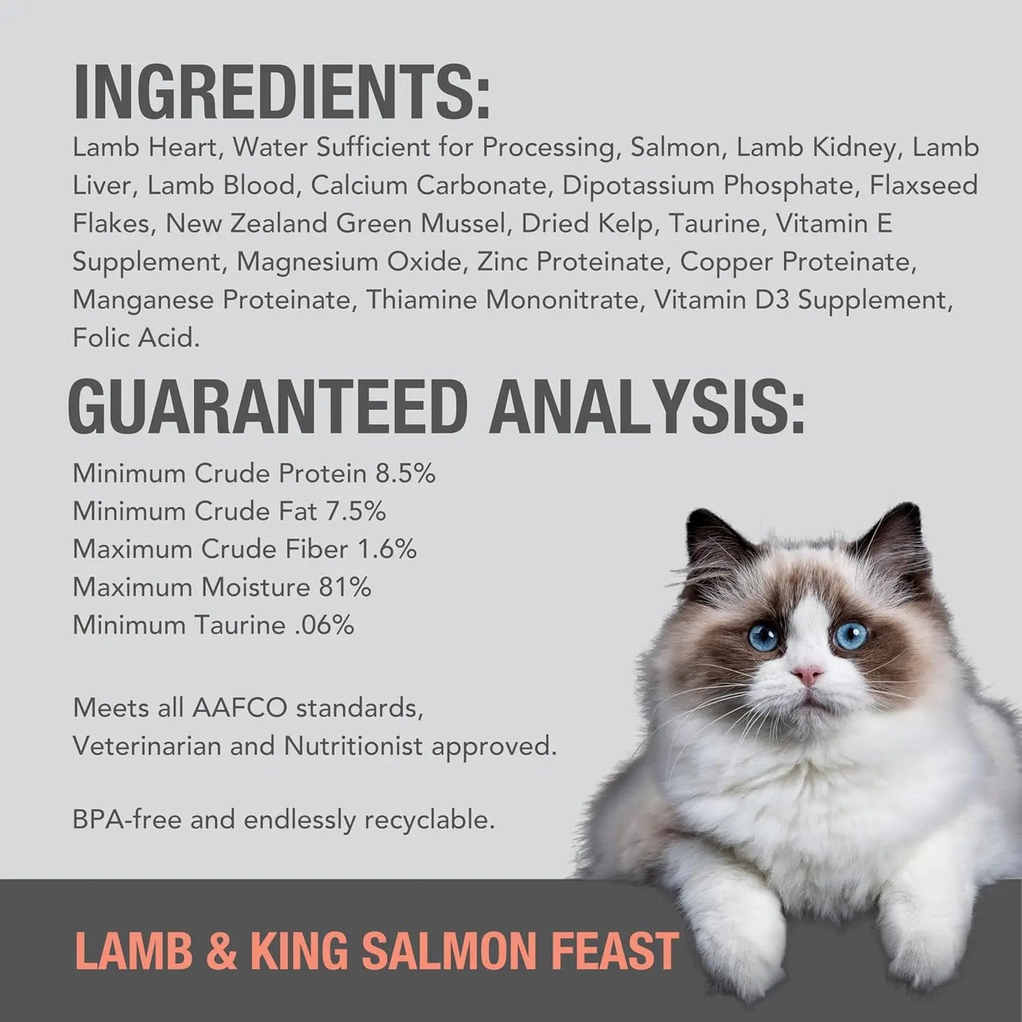 A fluffy white and grey cat with blue eyes sits next to the Feline Natural Lamb & King Salmon Feast Grain-Free Canned Cat Food label, highlighting its quality ingredients, guaranteed analysis, safety, and recyclable packaging.