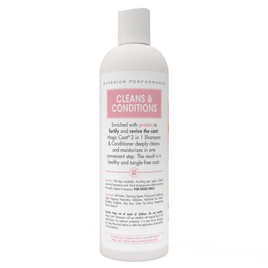A white, flip-top bottle of Four Paws Magic Coat Cleanse & Conditions 2-in-1 Dog Shampoo and Conditioner (16 oz) features pink and gray text highlighting its benefits for fortifying and reviving dog coats.
