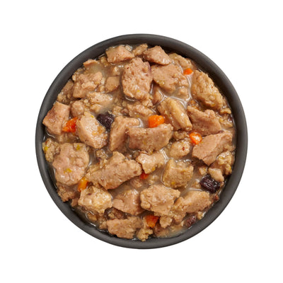 A black bowl of Petcurean Pet Foods Go! Solutions Booster Immune Health Minced Chicken & Salmon with Gravy Wet Cat Food, seen from above, showcases minced chicken, salmon, and veggies to help support cat immune health.