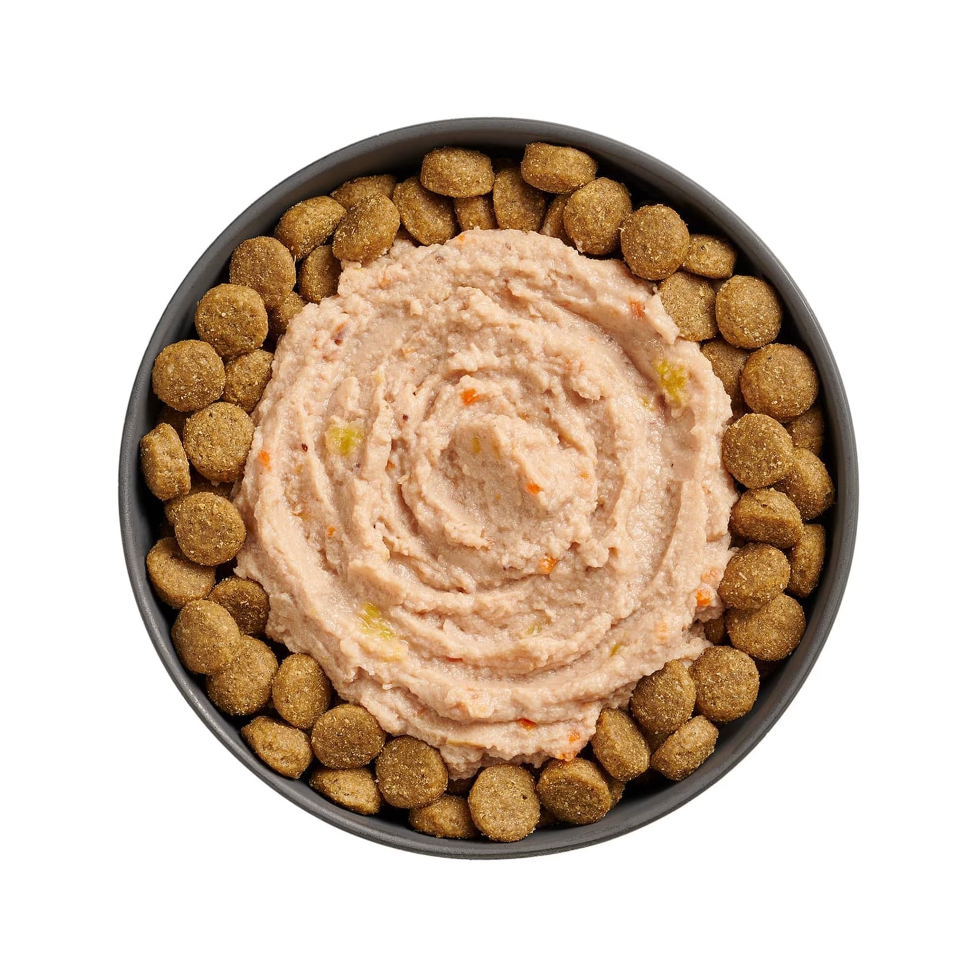 A bowl of grain-free brown kibble arranged around a swirl of Go! Solutions Booster Joint Care Chicken, Salmon & Duck Pate Wet Dog Food by Petcurean Pet Foods—perfect for senior dogs.