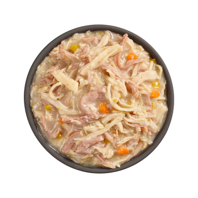 A black bowl of Petcurean Pet Foods Go! Solutions Booster Weight Management Shredded Chicken & Duck in Broth Wet Cat Food, 24ea/2.5 oz, with noodles, veggies, and creamy sauce is shown from above on a white background.