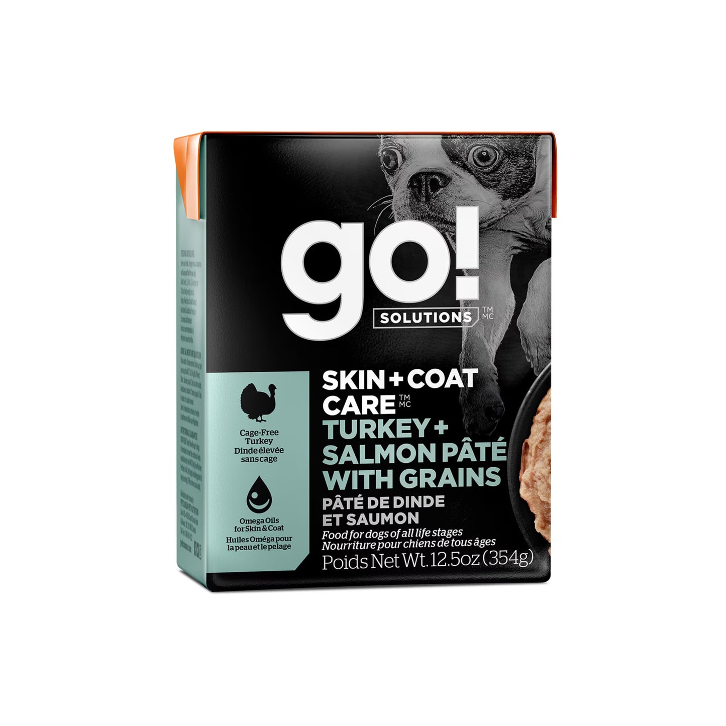 A box of Petcurean Pet Foods Go! Solutions Skin + Coat Care Turkey & Salmon Pate Dog Food, 12-pack of 12.5 oz cans, featuring a photo of a dog and a bowl of pâté on the packaging.