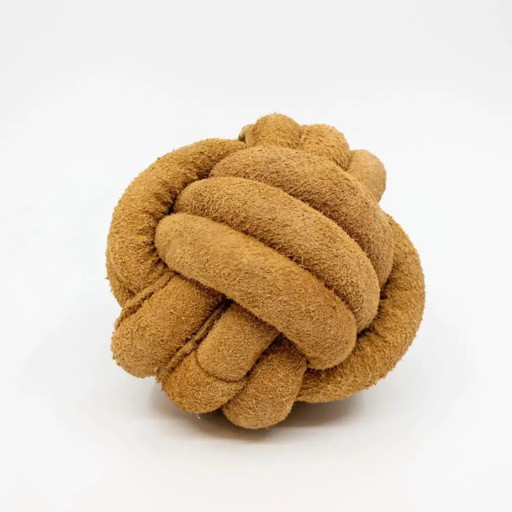 The HuggleHounds HuggleHide Natural Leather Ball Dog Toy is a durable, textured chew toy in light brown, featuring a cozy, interwoven design—perfect for dogs who love to chew. Brand: HuggleHounds.