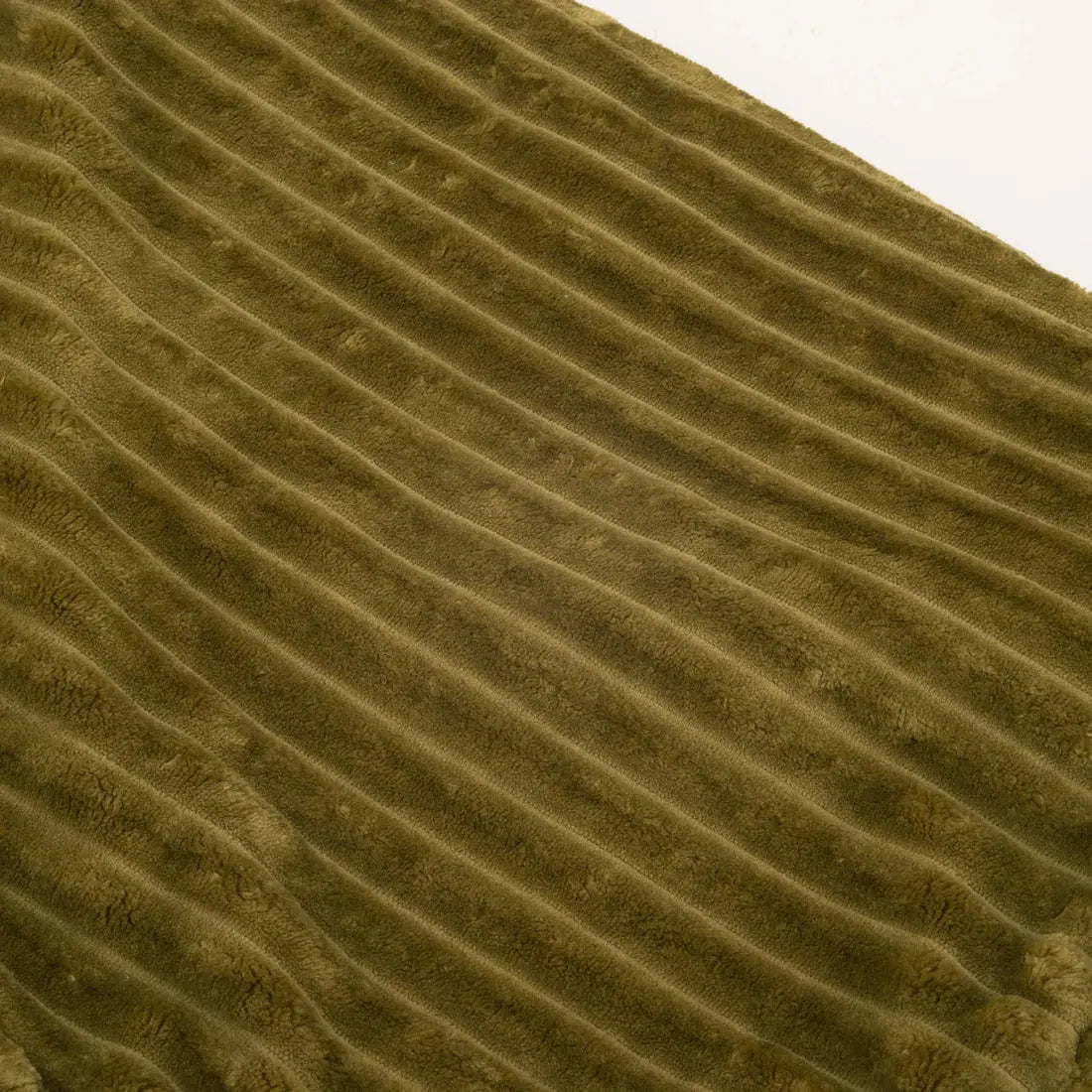 Close-up of HuggleHounds Scout Blankie Double-Sided Plush Dog Blanket in olive green corduroy, highlighting its signature parallel ridges and soft texture.