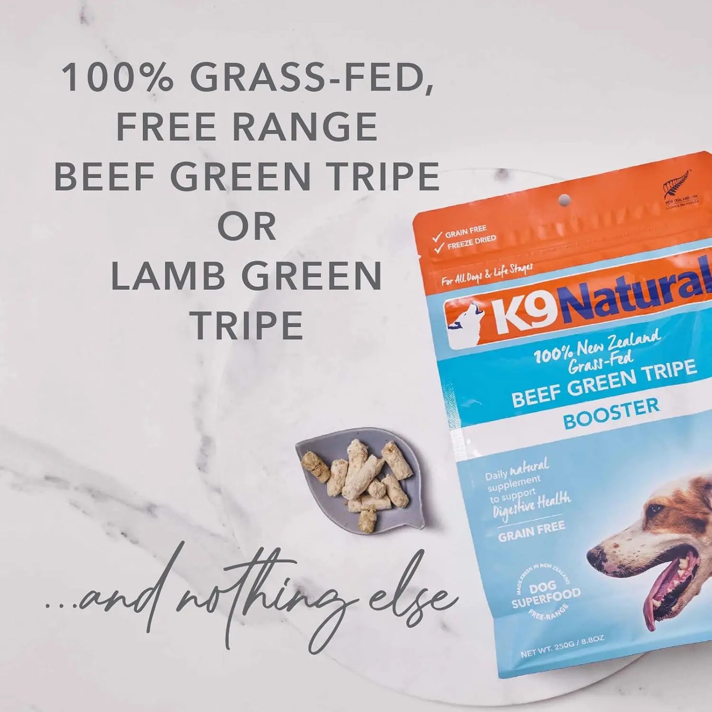 A pack of K9 Natural Lamb Green Tripe Booster Digestive Supplement for Dogs sits on a marble surface beside a small bowl, featuring text: 100% grass-fed, free-range tripe—a natural digestive supplement and nothing else.