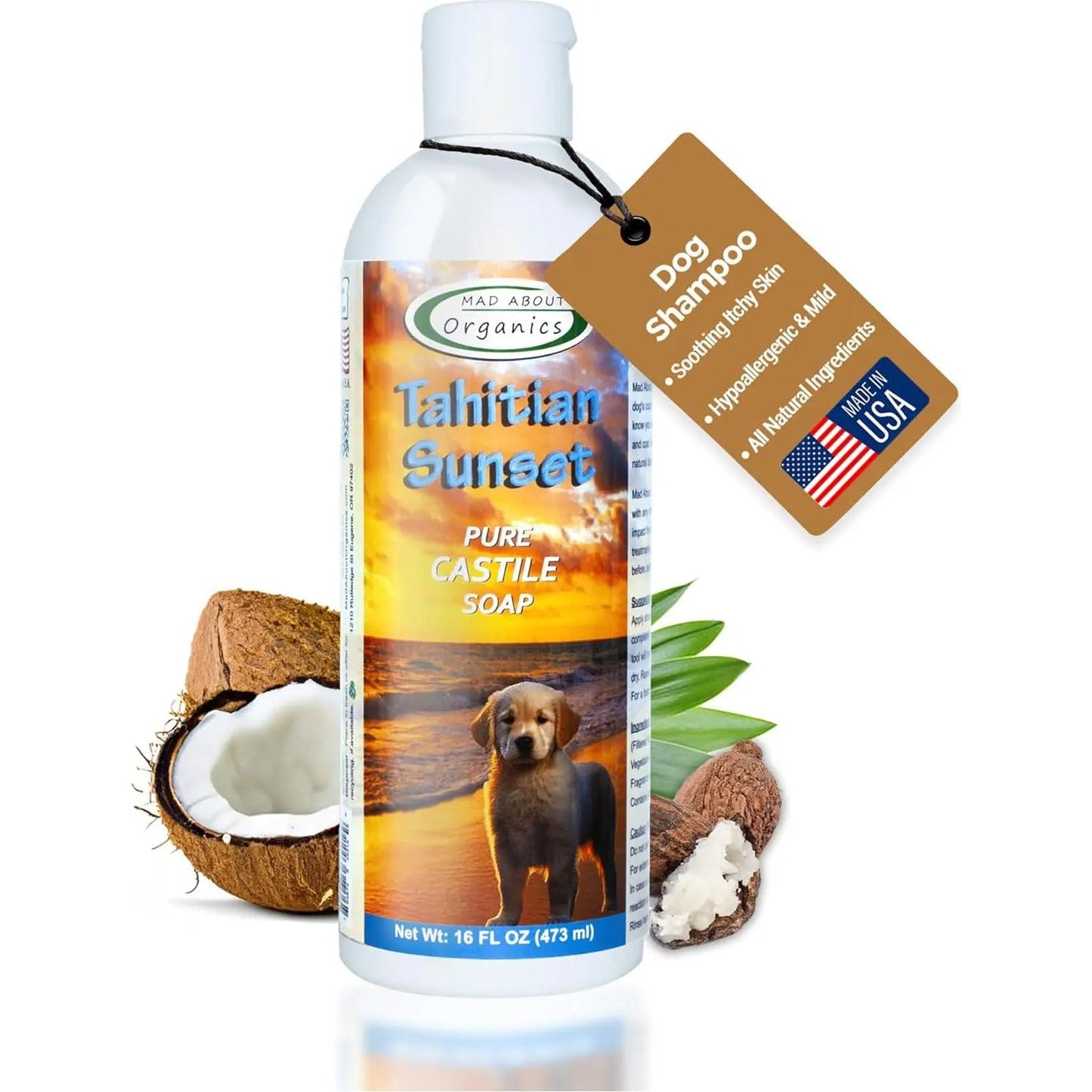 Mad About Organics Tahitian Sunset Dog Shampoo 16oz features a puppy and tropical scene on the label, highlights sensitive skin benefits on the tag, and displays coconuts beside the bottle.