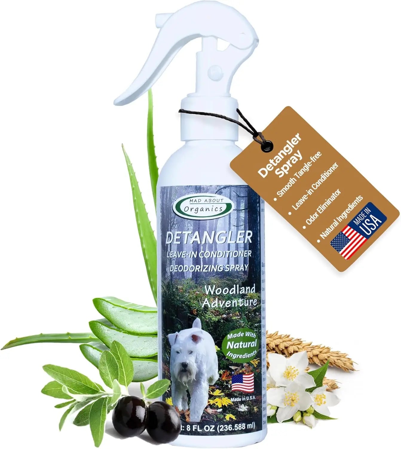 A spray bottle of Mad About Organics Detangler Spray - Knot-Free Coats Made Easy 8oz, labeled leave-in conditioner and deodorizing spray for dogs with cedarwood scent, aloe vera and olive ingredients, features a white dog image and all-natural formula.