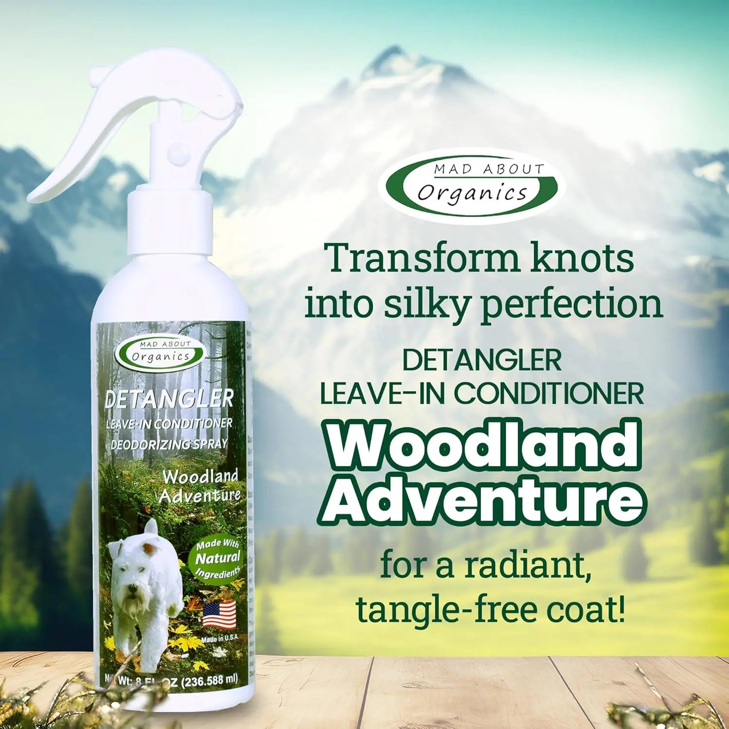 A bottle of Mad About Organics Detangler Spray – Knot-Free Coats Made Easy 8oz is shown by a white dog in a forest, highlighting its cedarwood scent and all-natural formula for silky, tangle-free pet coats.