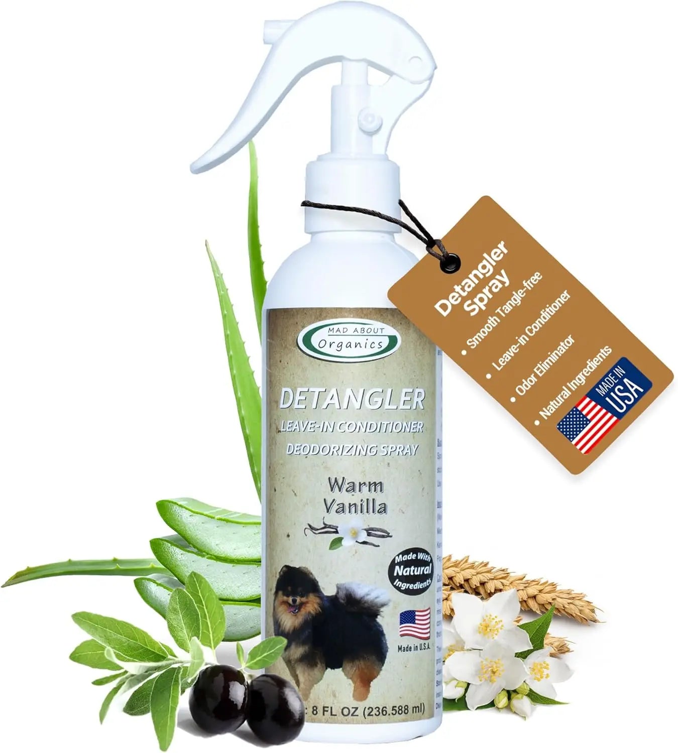 An 8oz spray bottle of Mad About Organics Detangler Spray—Knot-Free Coats Made Easy—features a warm vanilla cedarwood scent, ingredients like aloe, olive, and oats, and a brown tag highlighting features plus a Made in USA label.