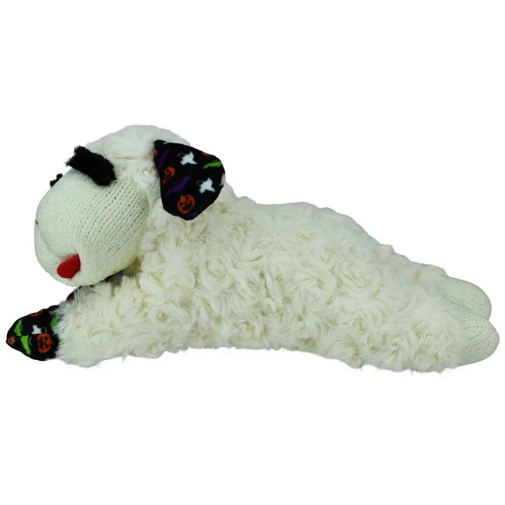 Lamb Chop dog toy in a lying position with Halloween pumpkin and ghost accents