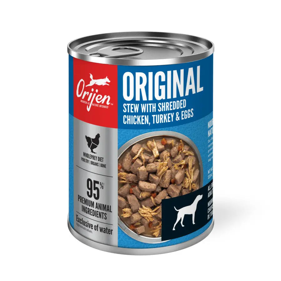 A can of ORIJEN Real Meat Shreds Chicken, Turkey & Eggs Recipe Stew Grain-Free Wet Dog Food (12ea/12.8 oz), highlighting 95% animal ingredients, features an image of the stew and a white dog icon on a blue label.
