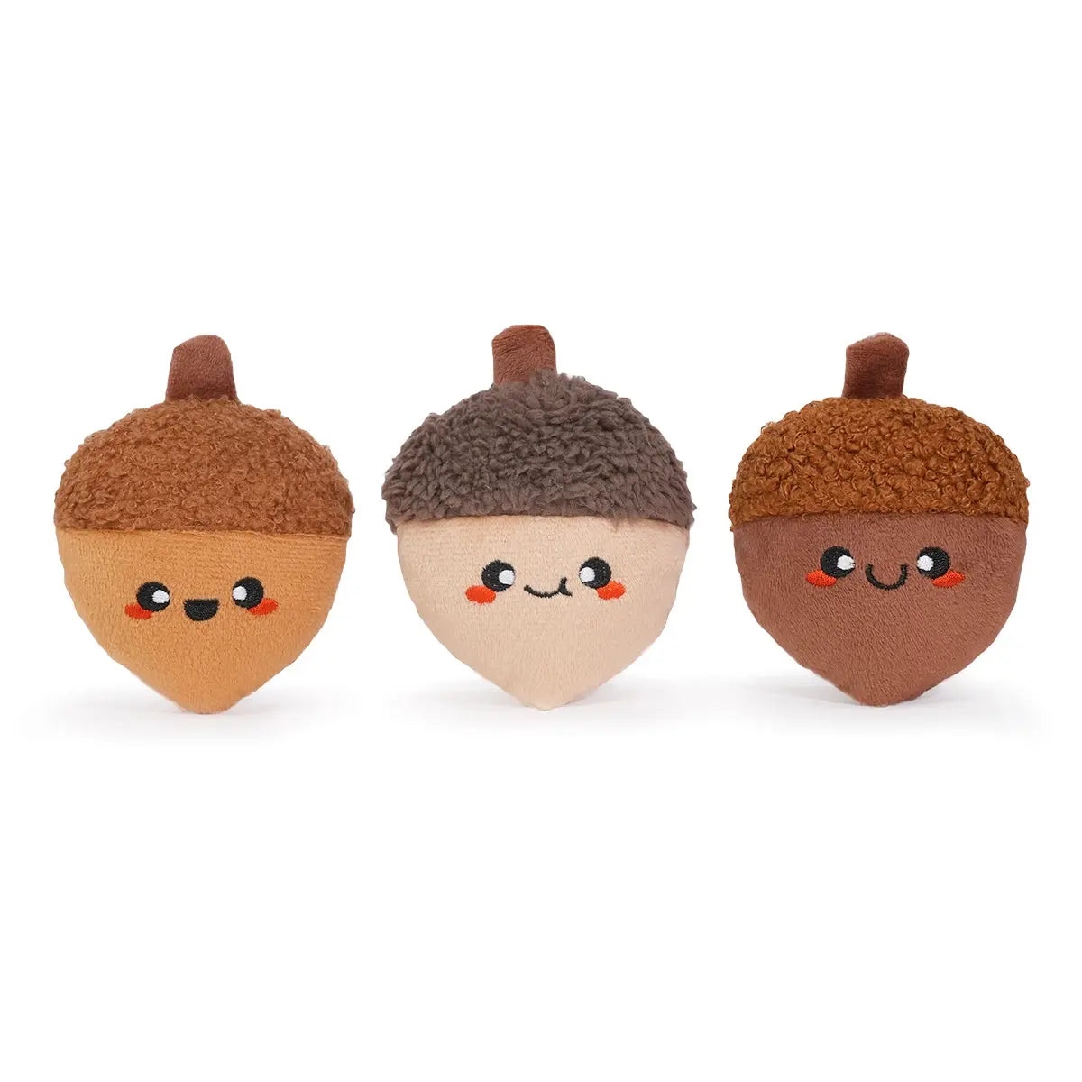 The Hugsmart Pet Oriland Pet Autumn Woofs Acorn Tree Interactive Dog Toys feature three brown plush squeaky acorns with smiling faces and textured tops, arranged in a row on a white background.