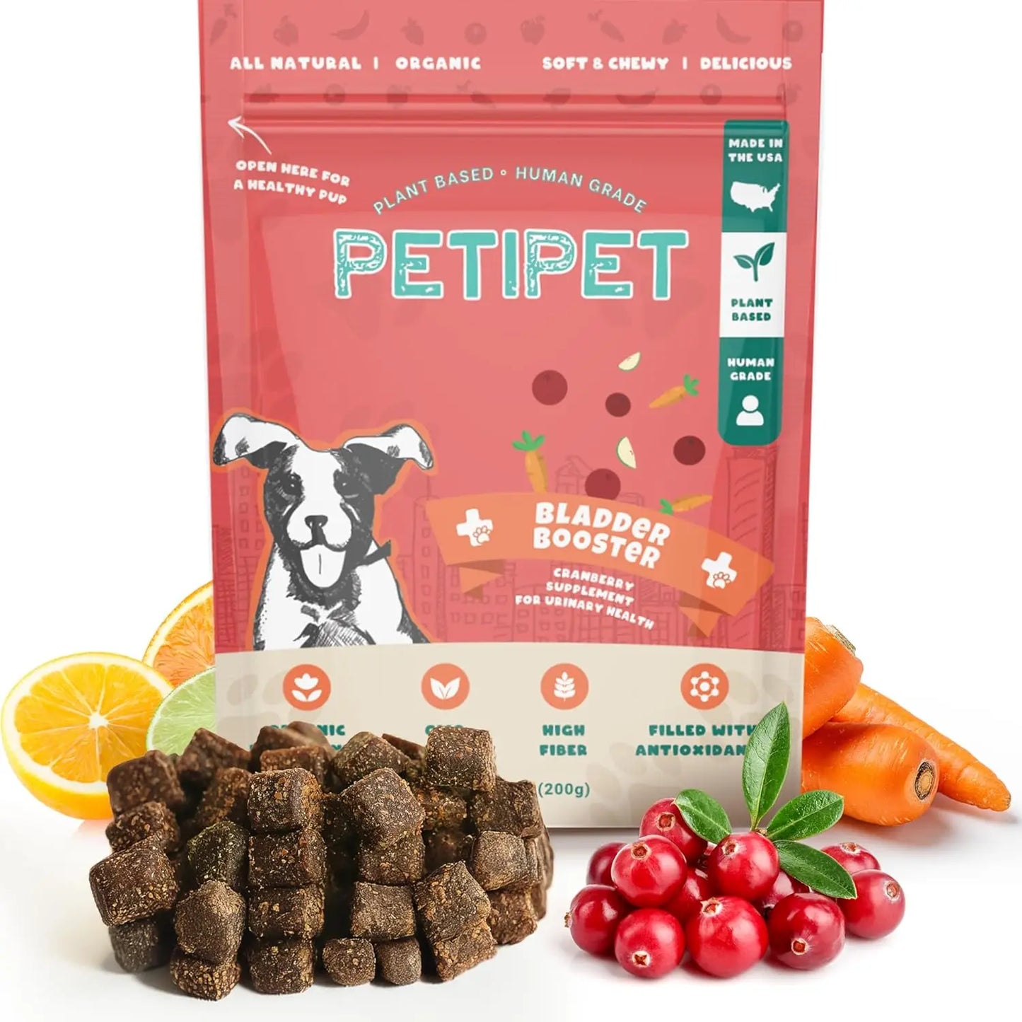 A bag of PETIPET Bladder Booster Cranberry Chews for Dogs 7oz is shown with treat squares, cranberries, carrots, an orange slice, and green leaves. The package highlights plant-based chews that support urinary and kidney health.
