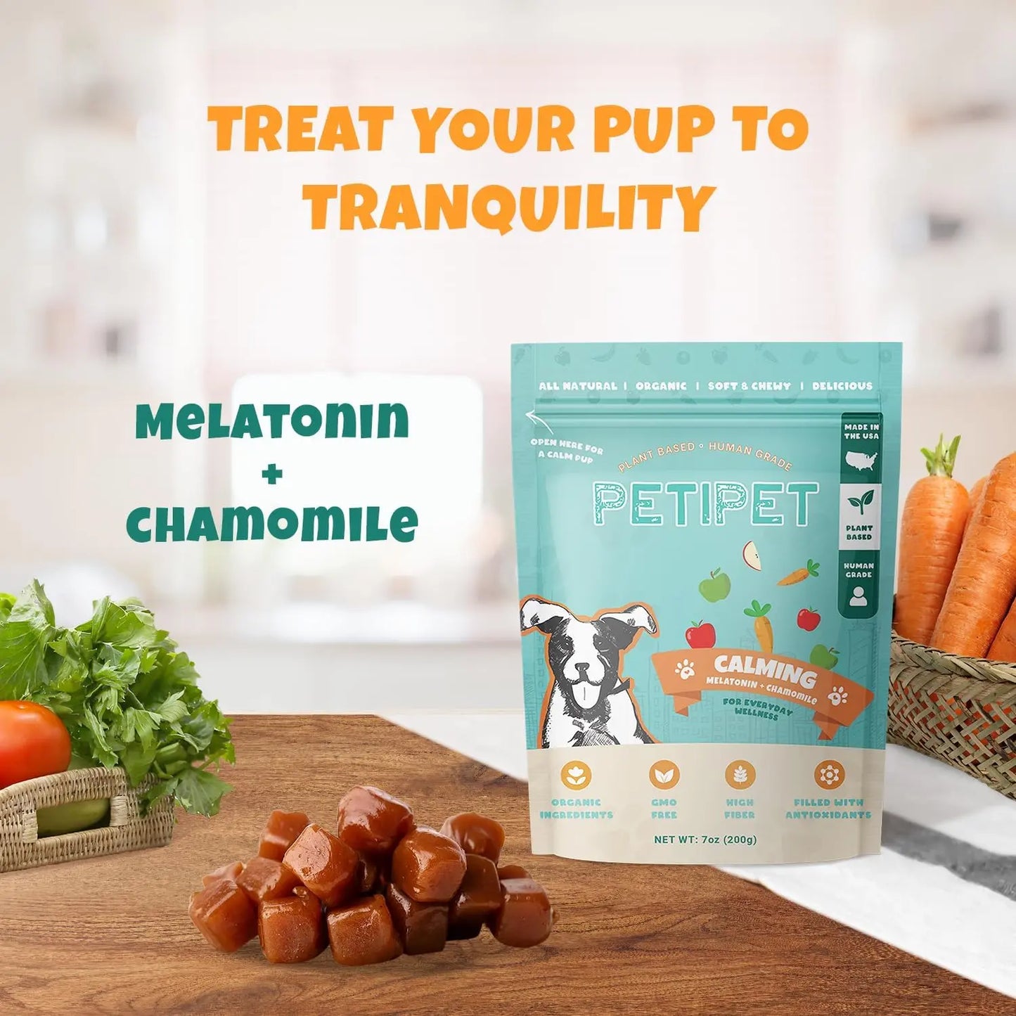 A bag of PETIPET Calming Bites with Melatonin + Chamomile Apple & Carrot Flavored Soft Chew Calming Supplement for Dogs 7oz rests on the counter, surrounded by fresh carrots and greens. Orange text reads: TREAT YOUR PUP TO TRANQUILITY—perfect stress relief for dogs.