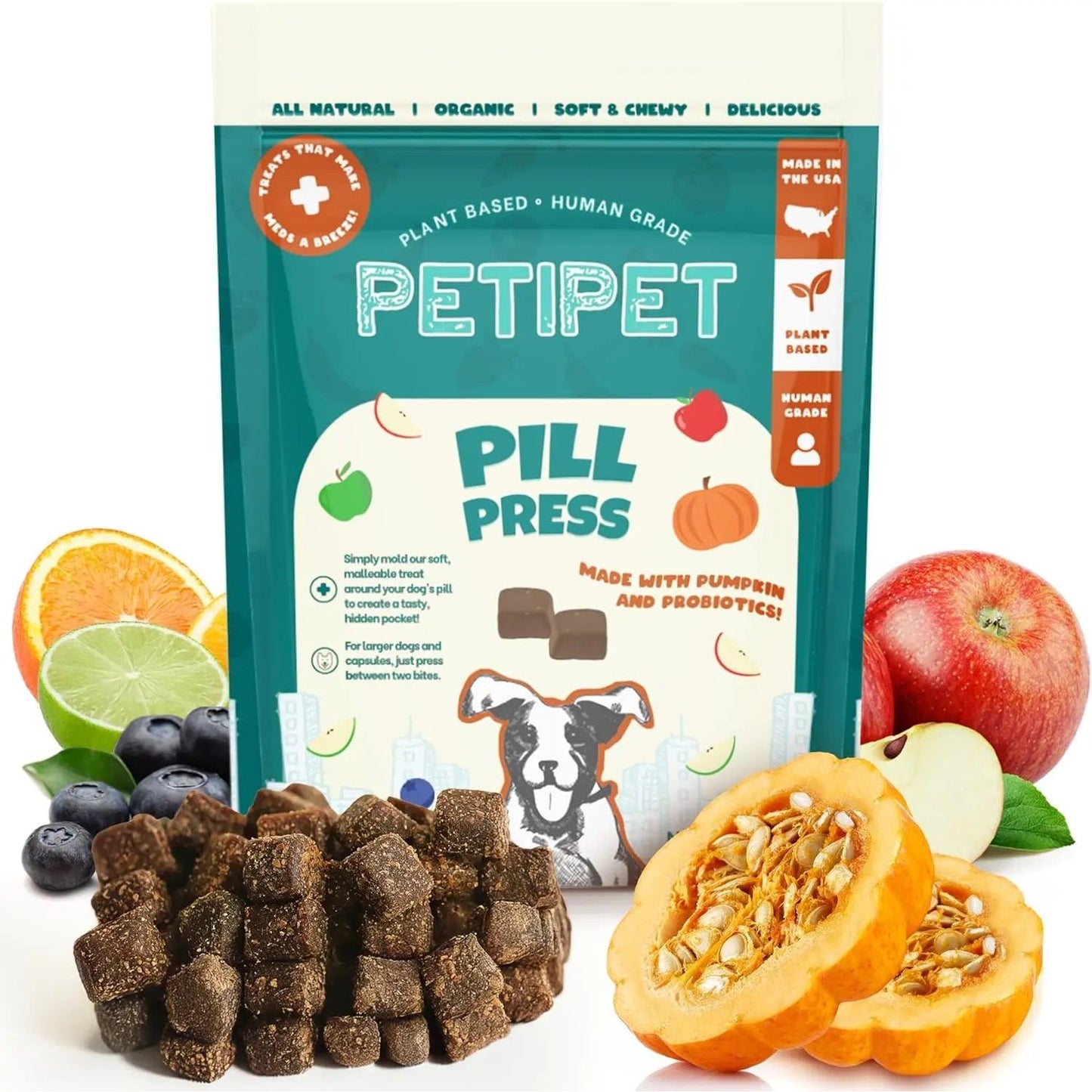 A bag of PETIPET Pill Press Dog Treats - Easy Capsule & Tablet Hider, Vegan Chews with Pumpkin & Probiotics 7oz, is shown with treats in front and fresh fruits and vegetables nearby to highlight the plant-based ingredients.