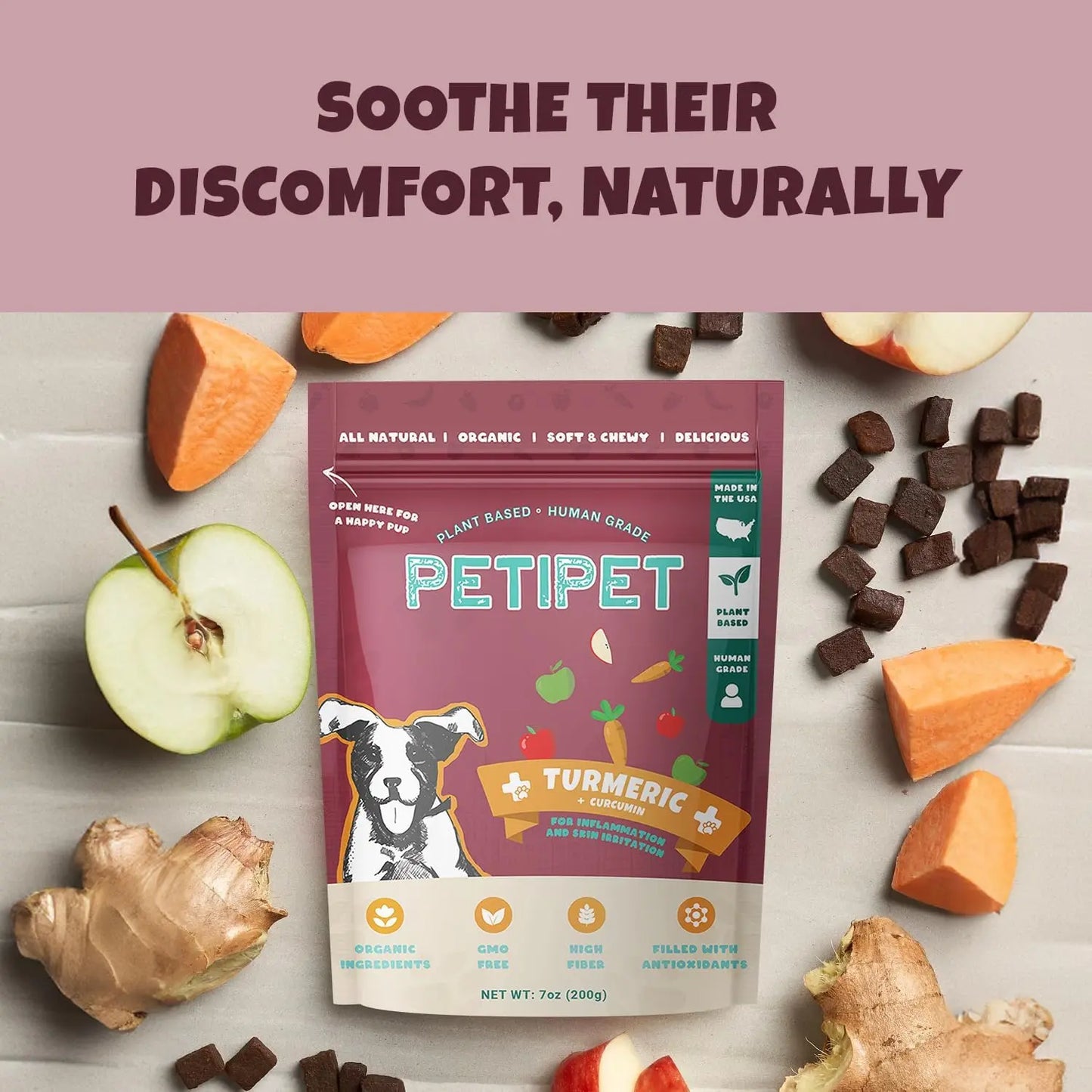 A bag of PETIPET Turmeric Bites + Curcumin Apple & Carrot Soft Chew Anti-Inflammatory Supplement for Dogs 7oz is surrounded by apple slices, ginger, and turmeric. The packaging highlights organic, plant-based ingredients and curcumin for relief. Text: Soothe Their Discomfort, Naturally.