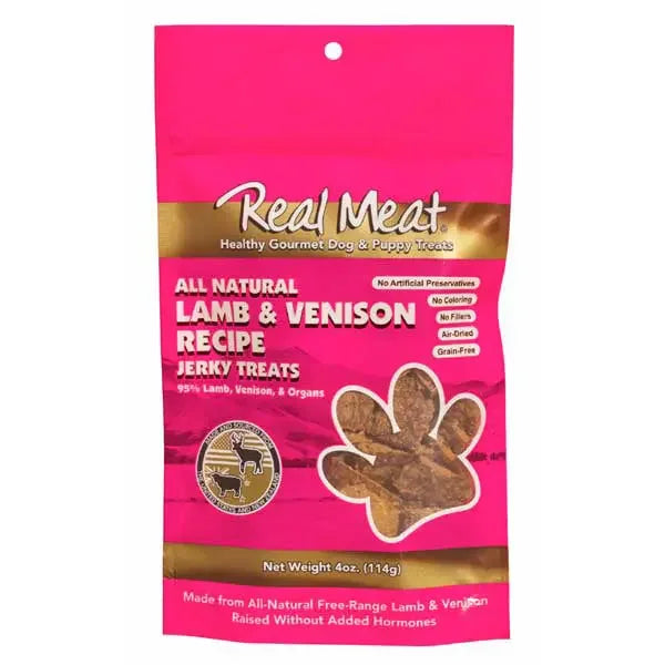 A pink and red 4 oz (114g) bag of Real Meat® Lamb Venison Jerky Dog Treat features an all-natural lamb & venison recipe with New Zealand Lamb, no artificial preservatives, and is grain-free.