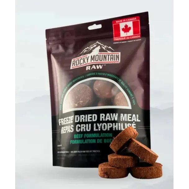 A bag of Rocky Mountain Raw Premium Freeze-Dried Raw Meal for Dogs Beef Formula 14 oz features a Canadian flag and several round, brown patties stacked in front—ideal for providing natural dog nutrition.