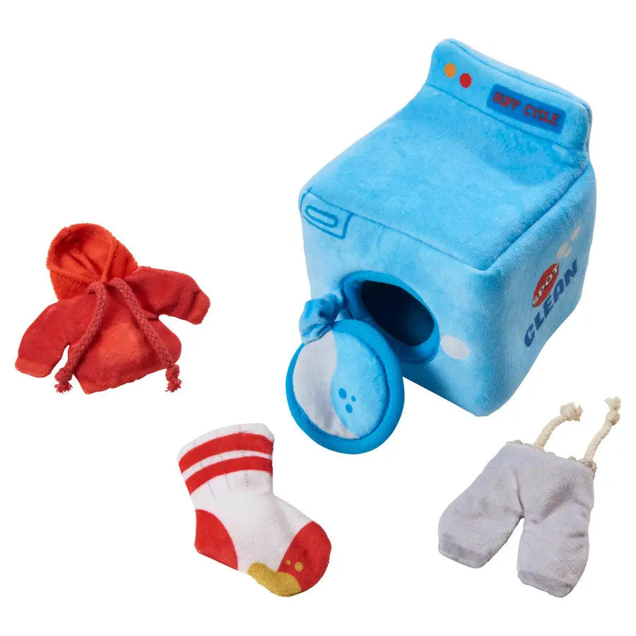 The Spot Wash Day Puzzle Dog Toy 6 in by Spot is a plush toy set with a blue washing machine, red hoodie, white sock with red stripes and yellow toe, and gray pants—an interactive toy for mental stimulation for dogs.