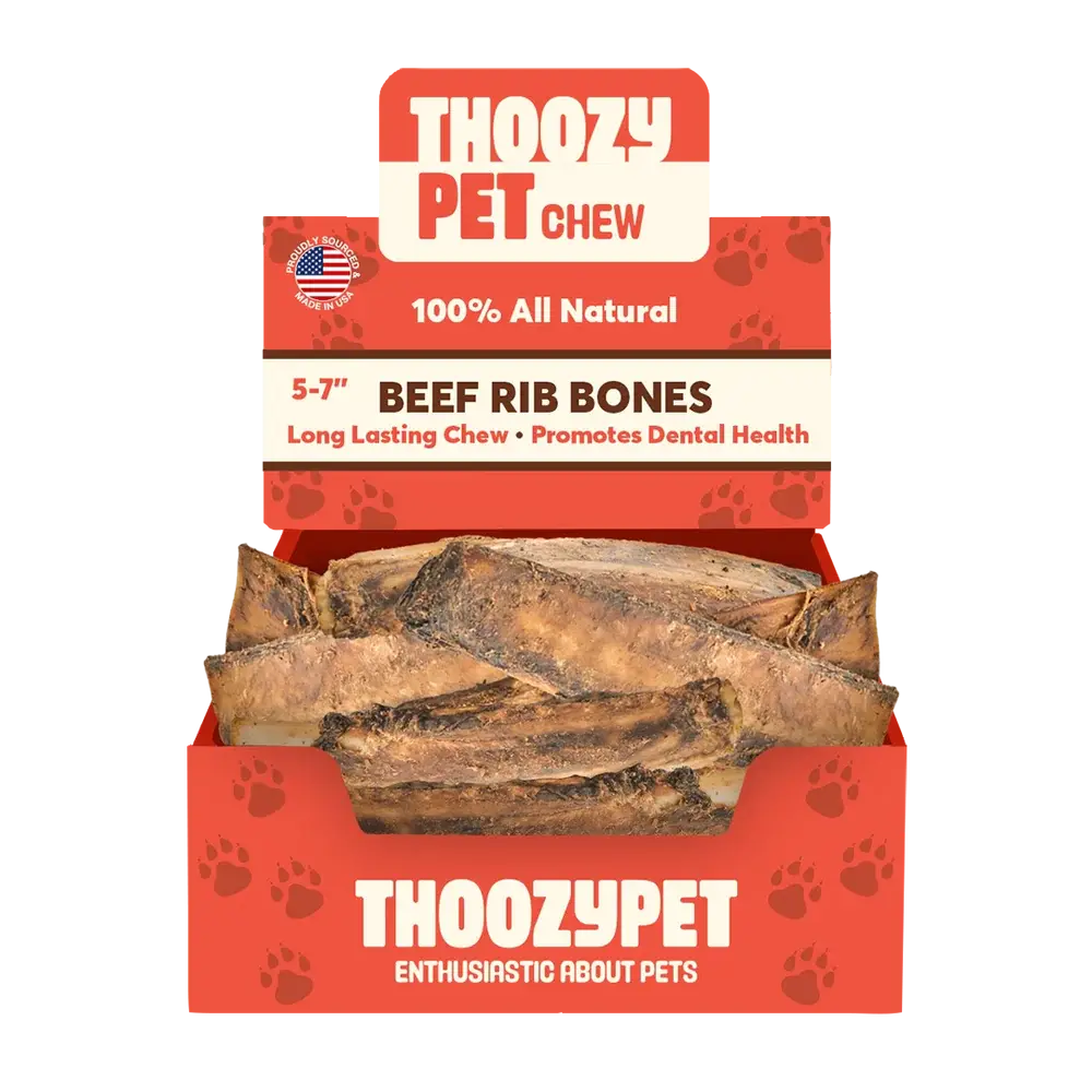 A red box labeled ThoozyPet contains 50 USA-sourced beef rib bone dog chews (5-7). Packaging highlights 100% all-natural treats, long-lasting chew, and dental health benefits.