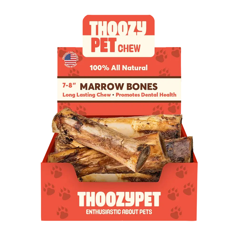 Open display box of ThoozyPet USA-Sourced Marrow Center Bone Dog Chews 7-8 20ct, all natural, long-lasting treats that promote dental health—several large brown bones are visible inside.