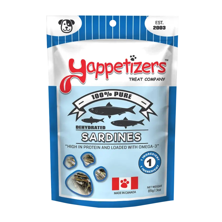 A blue and white Yappetizers bag contains Dehydrated Sardines Dog Treats, emphasizing 100% purity, high protein, omega-3 for cognitive health, proudly made in Canada. Features sardine images with a net weight of 3 oz (85g).