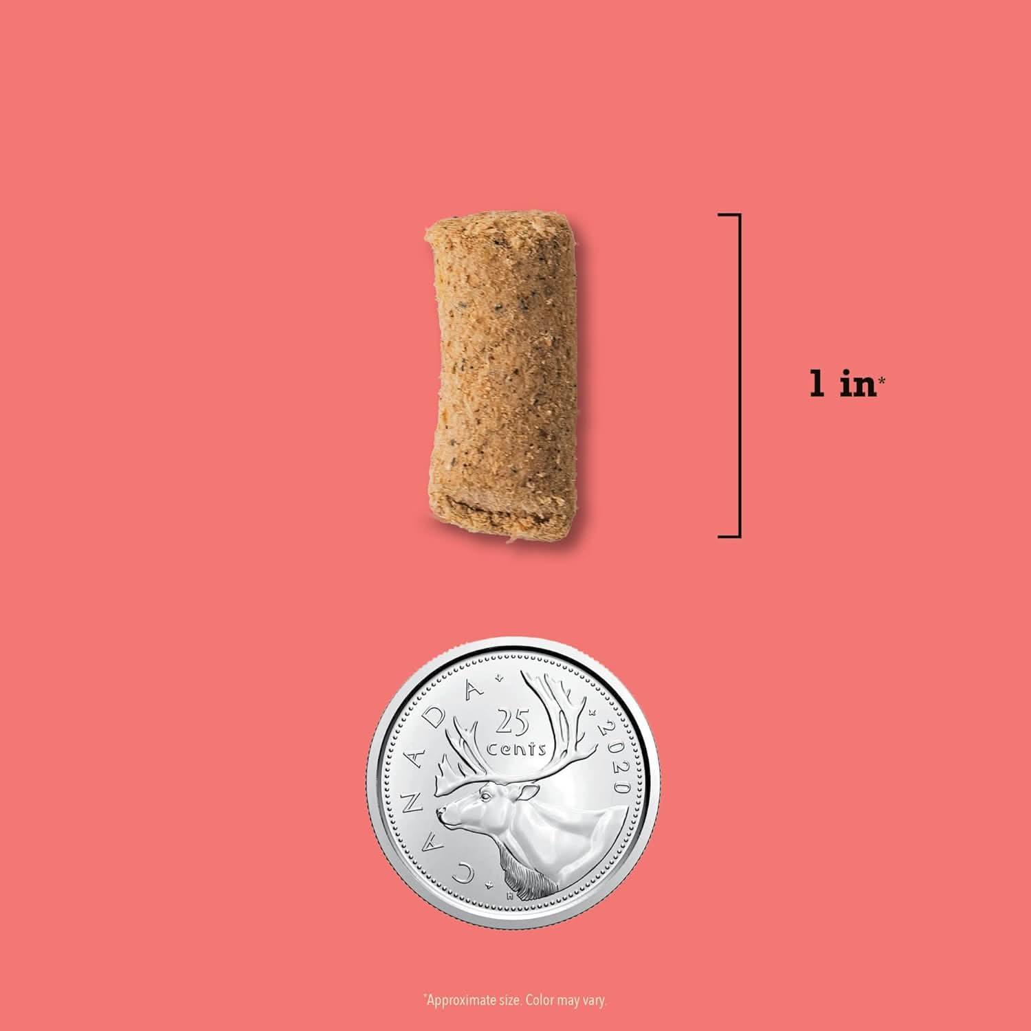 Acana Freeze-Dried Dog Food sample next to a Canadian quarter for size comparison
