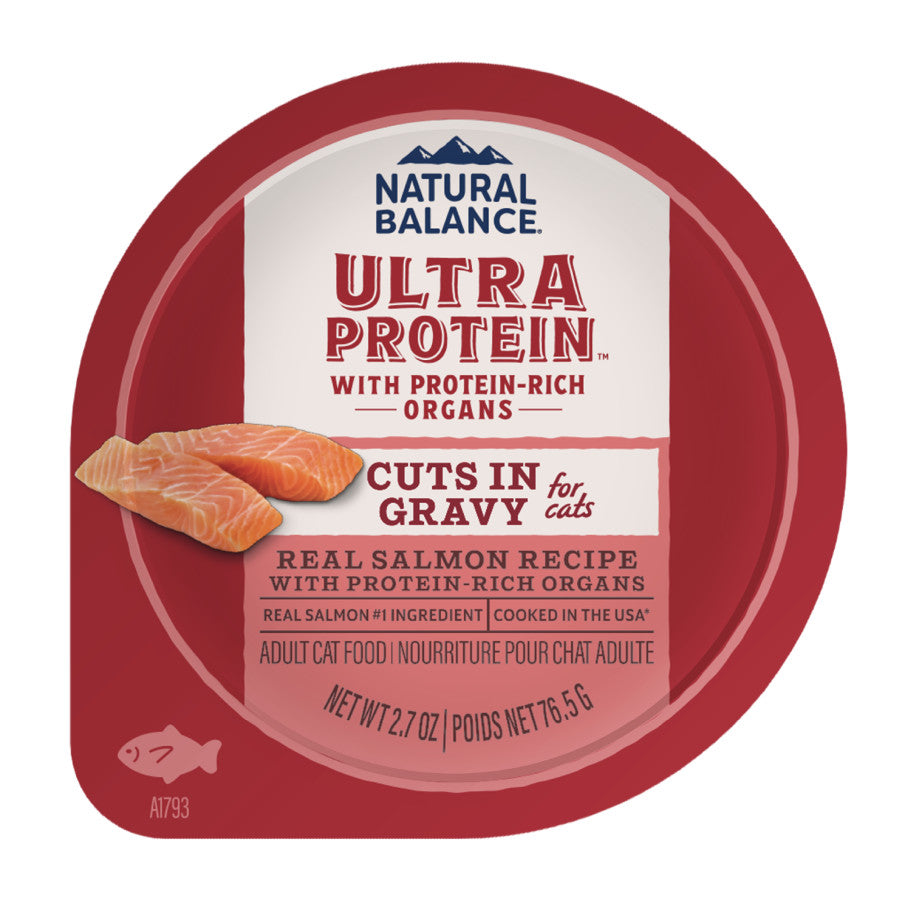 A round red package of Natural Balance Ultra Protein Cuts in Gravy Wet Cat Food, 10 pack of 2.7 oz each, features real salmon pieces and bilingual English/French product details on the label.