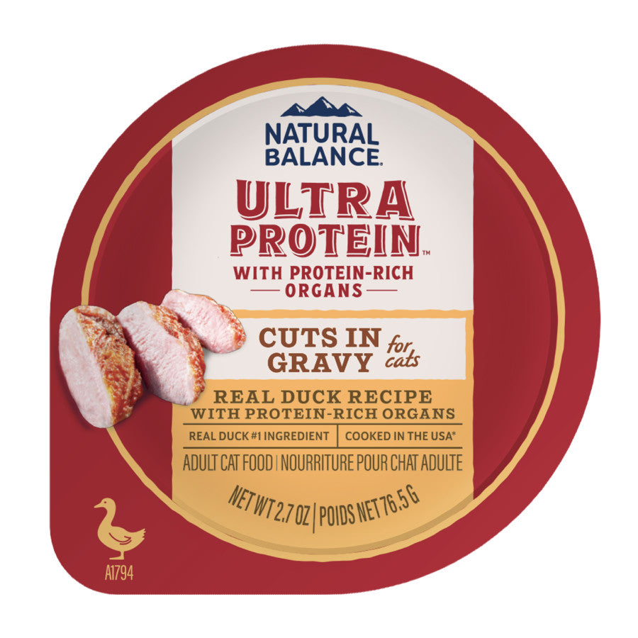 A red and gold container of Natural Balance Ultra Protein Cuts in Gravy Wet Cat Food (2.7 oz) features real duck, protein-rich organs, label images of sliced duck, and product details. Sold as 10 per pack.
