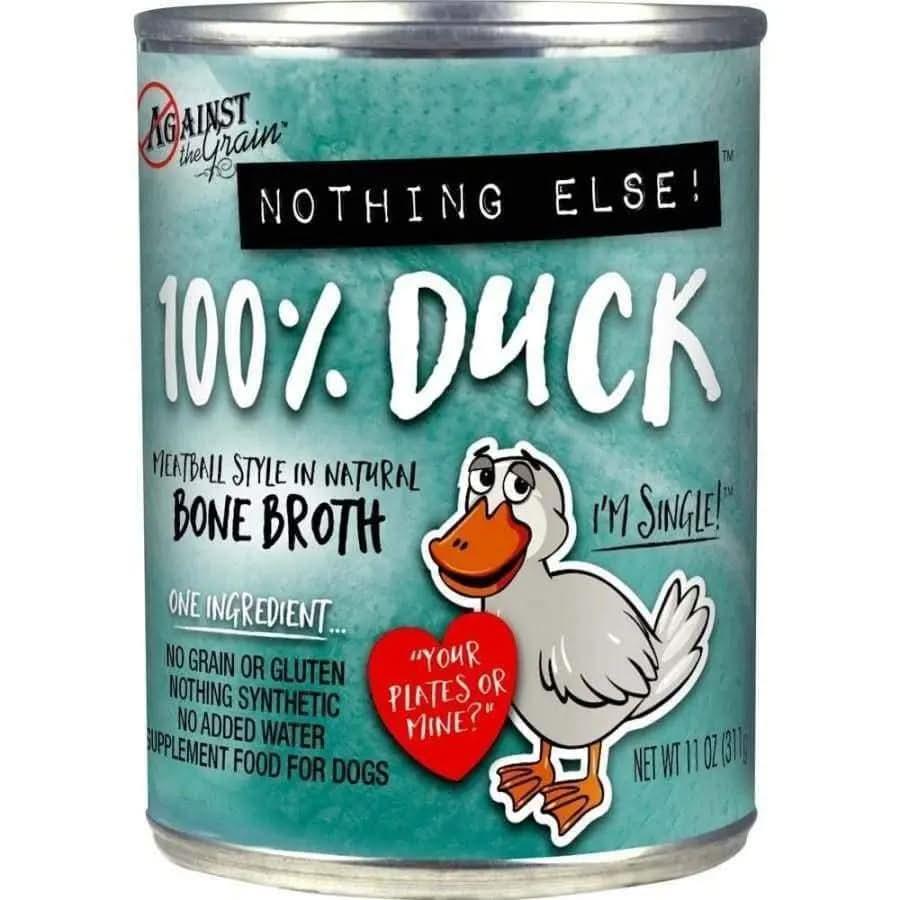 Against the Grain Nothing Else One Ingredient Duck Dog Food, 11-oz cans (case of 12), features 100% duck with no additives, grain free, gluten free, and made with bone broth. The can shows a cartoon duck holding a heart that says, Your plate or mine?.