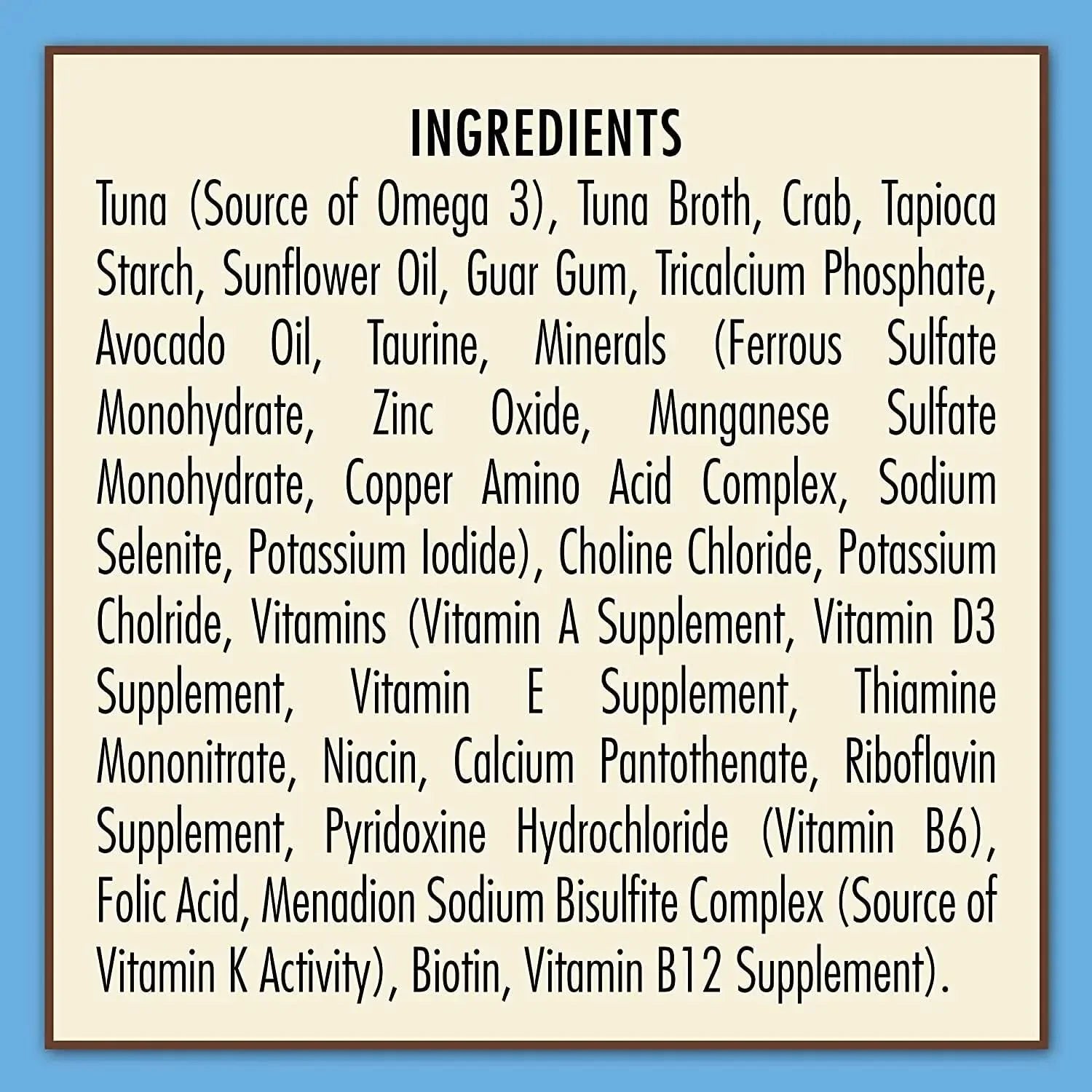 The ingredients label for AvoDerm Grain Free Tuna & Crab Entree in Gravy Canned Cat Food 24ea lists tuna, crab, tapioca starch, sunflower oil, vitamins, and minerals on a beige background with a blue border.