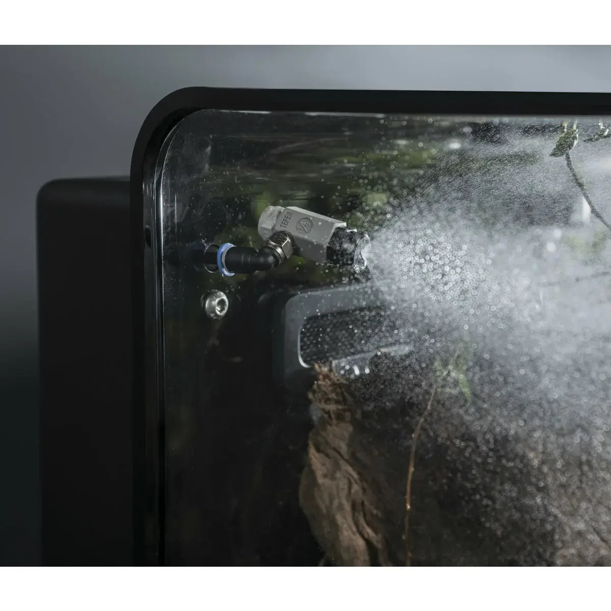 Water misting feature in action inside the BiOrb Earth 125 Smart Terrarium