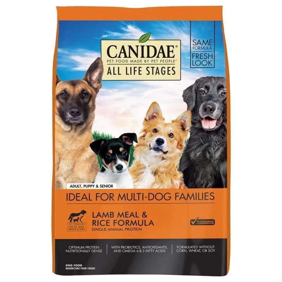 A bag of CANIDAE All Life Stages Lamb Meal & Rice Formula Dry Dog Food shows four dogs and emphasizes its high-quality ingredients. Suitable for multi-dog homes, its ideal for adult dogs, puppies, and seniors.