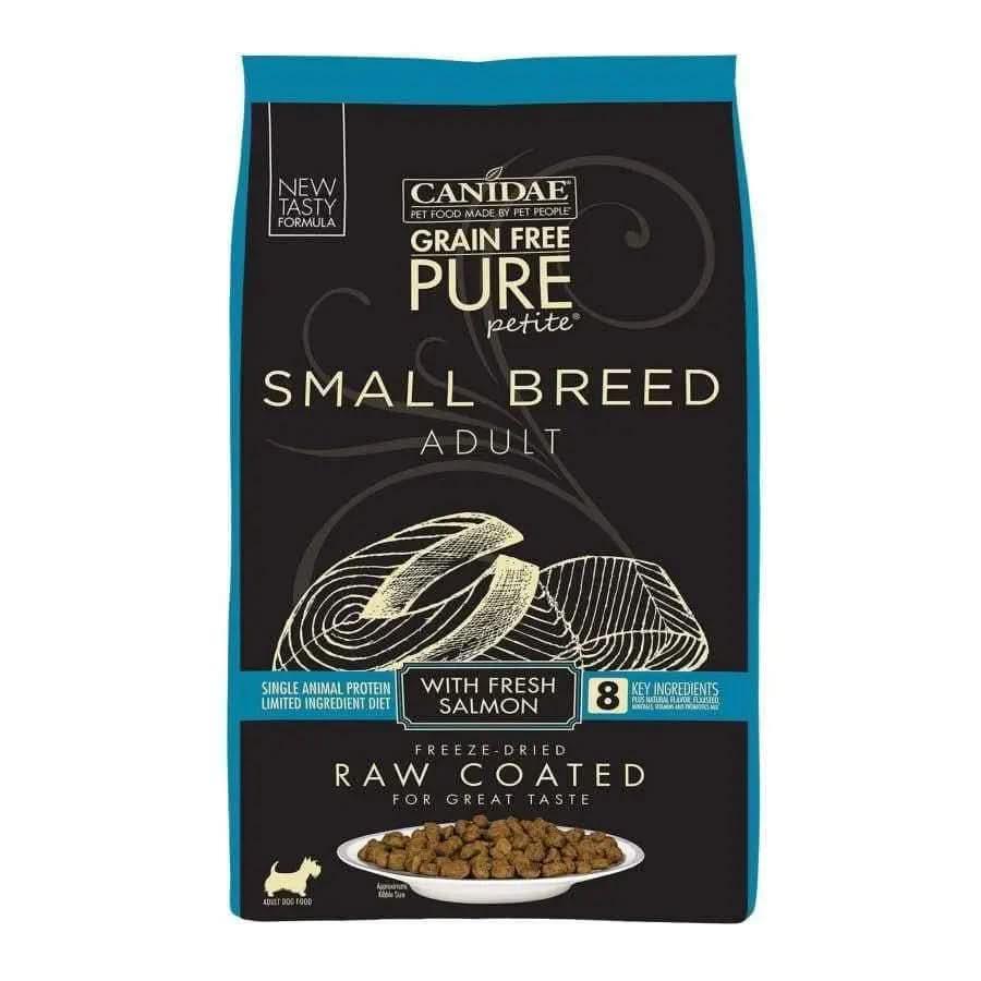 A bag of CANIDAE PURE Grain-Free Petite Small Breed Adult Raw Coated with Salmon Freeze-Dried Dry Dog Food features fresh salmon and comes in black packaging with blue accents showing salmon, kibble, and product details.