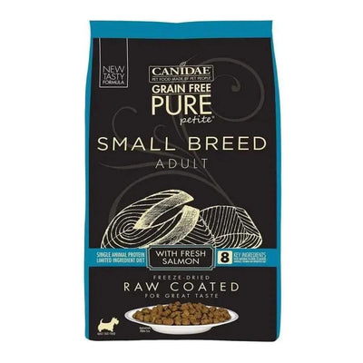A bag of CANIDAE PURE Grain-Free Petite Small Breed Adult Raw Coated with Salmon Freeze-Dried Dry Dog Food features fresh salmon and comes in black packaging with blue accents showing salmon, kibble, and product details.