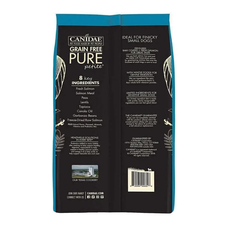 A blue and white CANIDAE PURE Grain-Free Petite Small Breed Adult Raw Coated with Salmon Freeze-Dried Dry Dog Food bag for small dogs, featuring 8 key ingredients, fresh salmon, freeze-dried meat, branding, and nutritional info on the pack.