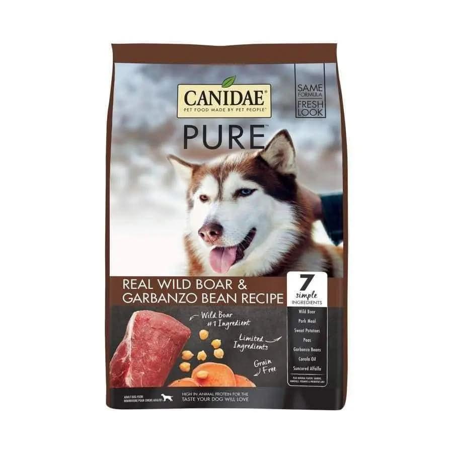 A CANIDAE PURE Grain-Free Real Wild Boar & Garbanzo Bean Recipe Top Dry Dog Food bag shows a husky face and images of meat and beans. With just 7 ingredients, it’s ideal for sensitive dogs seeking simple nutrition.