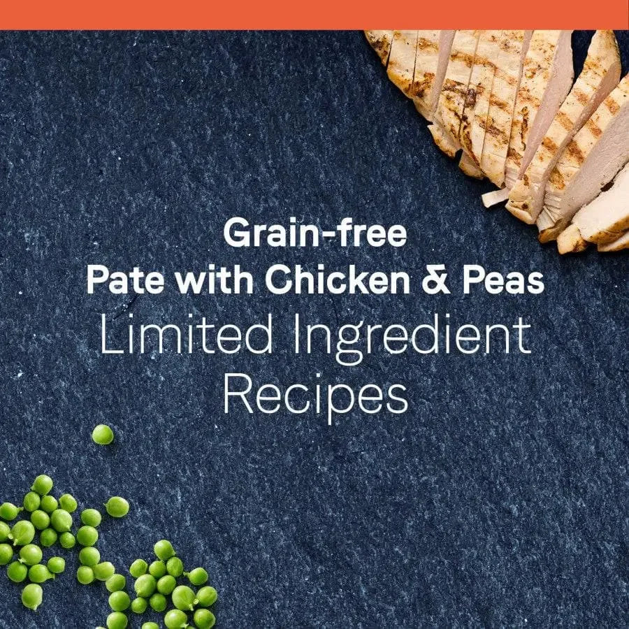 Sliced grilled chicken breast and green peas on a dark surface with text: CANIDAE PURE Petite Small Breed Grain-Free Wet Dog Food, limited ingredient recipe for small breed dogs. 12 trays of 3.5 oz each.