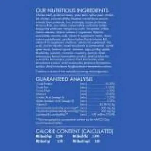 A blue label with white text highlights CANIDAE Under The Sun Grain-Free Large Breed Chicken Recipe Dry Dog Food’s single animal protein ingredients. The label also lists a nutrient table and calorie info, but the text is mostly unreadable.