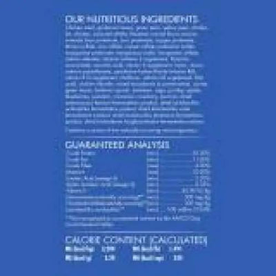 A blue label with white text highlights CANIDAE Under The Sun Grain-Free Large Breed Chicken Recipe Dry Dog Food’s single animal protein ingredients. The label also lists a nutrient table and calorie info, but the text is mostly unreadable.