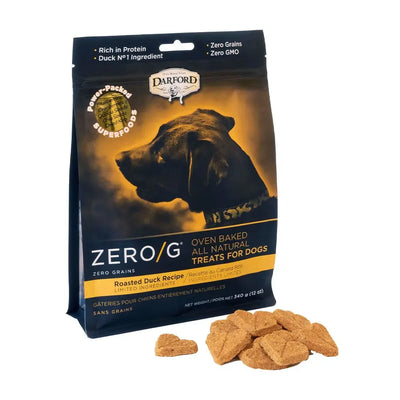 A 12 oz bag of Darford® ZERO/G Roasted Duck Oven Baked Dog Treats is shown with heart-shaped treats in front. The packaging displays a black dog and promotes limited-ingredient superfoods and zero grains.