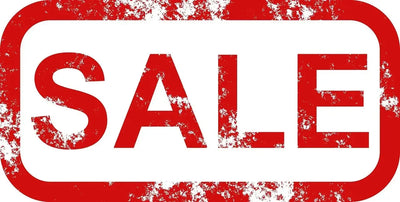 A red and white rectangular sign with the word SALE in large, bold red letters, featuring a distressed, weathered texture.