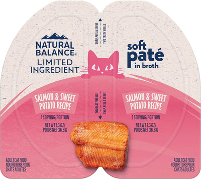 A box of Natural Balance Pet Foods Limited Ingredient Soft Pate in Broth Wet Cat Food, 10 packs of 2.6 oz each, features a salmon & sweet potato recipe with illustrated salmon and a pink cat on a beige and pink background.