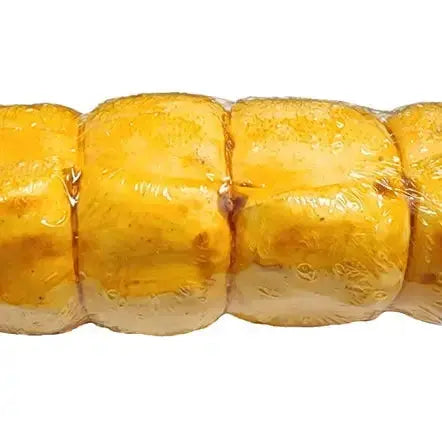 Close-up of Advance Pet Products All Natural Water Buffalo Cheek Roll Chews for Tough Chewers, wrapped to highlight their natural quality—ideal for pet owners who value wholesome treats and dental health for their dogs.